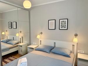 Posteľ alebo postele v izbe v ubytovaní M Plus Residence