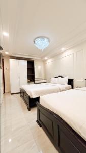 Postel nebo postele na pokoji v ubytování Elite SOFEA Saigon Hotel and Spa