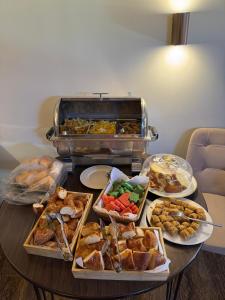 a table with many different types of food on it at Flavia Cappadocia Hotel in Uçhisar