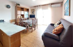 a living room with a couch and a table at Euromar Ii in Peñíscola
