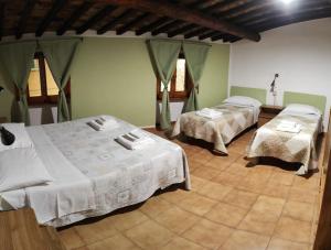 Ένα ή περισσότερα κρεβάτια σε δωμάτιο στο Hotel Gambassi