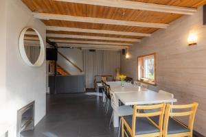 a dining room with a table and chairs at Beltes Guest House in Jūrmala