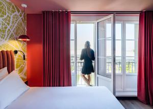 Postel nebo postele na pokoji v ubytování Le Grand Hotel