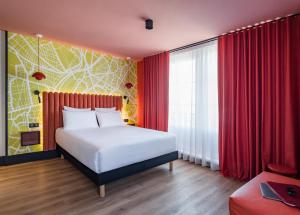 Postel nebo postele na pokoji v ubytování Le Grand Hotel