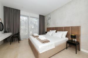 a bedroom with a large bed and a large window at Cloud 9 D10 in Tkon +39 photos