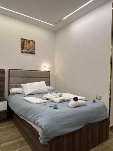 Кровать или кровати в номере Go Vibes Pyramids View INN