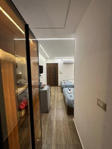 Кровать или кровати в номере Go Vibes Pyramids View INN