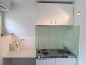 Kuchyňa alebo kuchynka v ubytovaní Linda Apartment