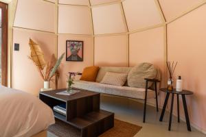a room with a couch and a table at Cabin Fata Morgana in Kats