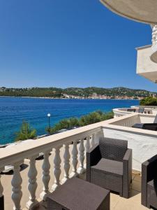 a balcony with a view of the water at Vila Nina in Tisno