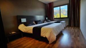 Katil atau katil-katil dalam bilik di Hotel Bruc