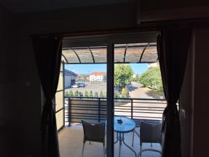 a view of a balcony with a table and chairs at Goka apartments in Gevgelija