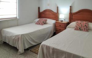 Ένα ή περισσότερα κρεβάτια σε δωμάτιο στο Cedeira 2