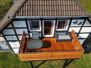 an overhead view of a small house with a deck at Ferienwohnung Frankenblick in Frankenau