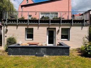 a house with a bench in front of it at Landhaus Buckow in Buckow