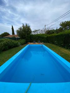 a large blue swimming pool in a yard at AMAZIGH VILLAS - 3 bedrooms, 2 bathrooms in Aljezur