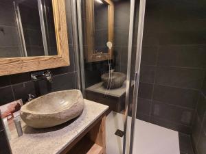 a bathroom with a sink and a shower at Appartement cosy pour 6 aux Gets avec WIFI et terrasse - FR-1-598-154 in Les Gets
