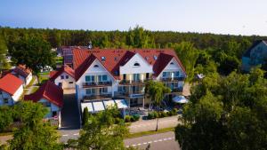 an aerial view of a house with red roofs at Nadmorski Łeba in Łeba