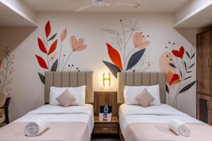 Postel nebo postele na pokoji v ubytování Hotel Classique, Rajkot