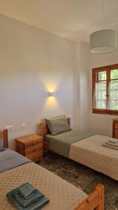 Postel nebo postele na pokoji v ubytování Holiday Home Neochori Pelion