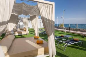 a living room with a view of the ocean at Sol Guadalmar in Málaga