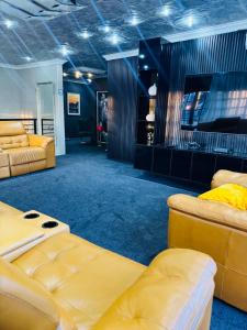 a room with two couches and a couch at Sejpro Living at 1 Motse Street in Polokwane +66 photos