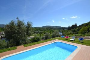 a swimming pool with a view of a mountain at Quinta Da Prova in Arcos de Valdevez