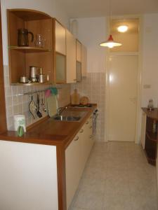a kitchen with a sink and a counter top at Marina Apartment in Crikvenica