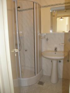a bathroom with a shower and a sink at Marina Apartment in Crikvenica