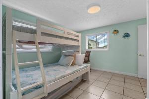 a bedroom with two bunk beds in a room at Spacious 2 Bedroom Condo for up to 8 Guests! Hartford Inlet 100 in Myrtle Beach +24 photos