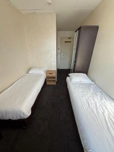 Letto o letti in una camera di Flex-Inn