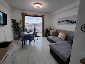 a living room with a couch and a table at Joy & Friends 1 in Los Cristianos