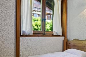 Piscine, Ski & Vue sur le lac - Crans 6 pers客房内的一张或多张床位