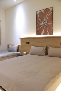 Postel nebo postele na pokoji v ubytování 躺平青旅-住宿推薦