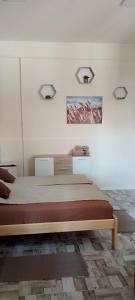 Posteľ alebo postele v izbe v ubytovaní Magnolia apartman