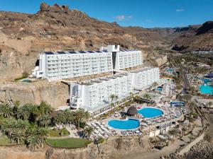 an aerial view of a resort with two pools at Princess Taurito in Taurito
