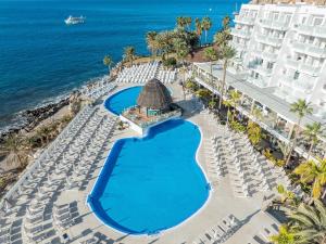 an aerial view of the hotel and the ocean at Princess Taurito in Taurito