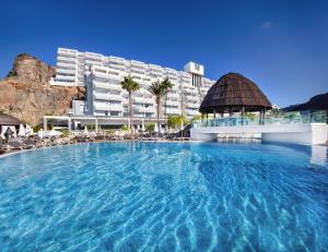 a large swimming pool in front of a hotel at Princess Taurito in Taurito +47 photos