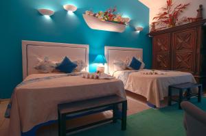 Rúm í herbergi á Hotel Coco Plaza