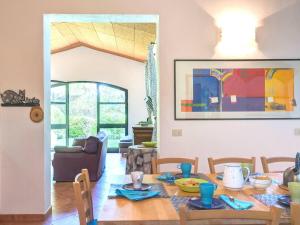 a living room with a table and a dining room at Grande, bella villa in Toscana vicino al mare in Capalbio