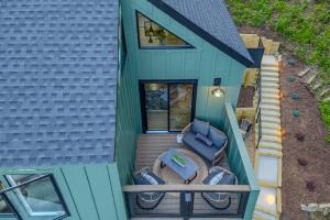 an overhead view of a house with a deck at Stunning Views Private Sauna Fireplace Fire Pit in Sugar Mountain