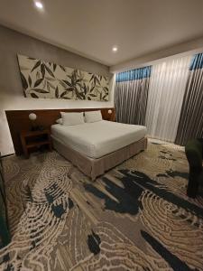 Postel nebo postele na pokoji v ubytování Isla Verde Hotel