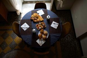 an overhead view of a table with food on it at 2'S b&b in Genova +12 photos