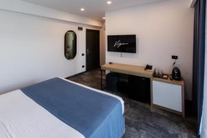 Postel nebo postele na pokoji v ubytování Hotel Vigo