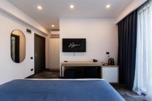 Postel nebo postele na pokoji v ubytování Hotel Vigo