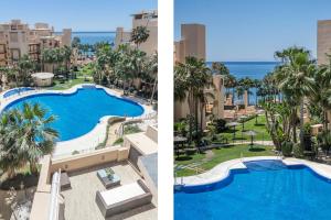 an aerial view of a resort pool and the ocean at BP7C.2A Beachfront Penthouse with Private Pool in Estepona