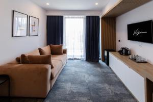 TV a/nebo společenská místnost v ubytování Hotel Vigo
