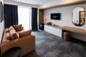 TV a/nebo společenská místnost v ubytování Hotel Vigo