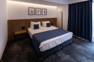 Postel nebo postele na pokoji v ubytování Hotel Vigo