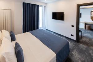 Postel nebo postele na pokoji v ubytování Hotel Vigo